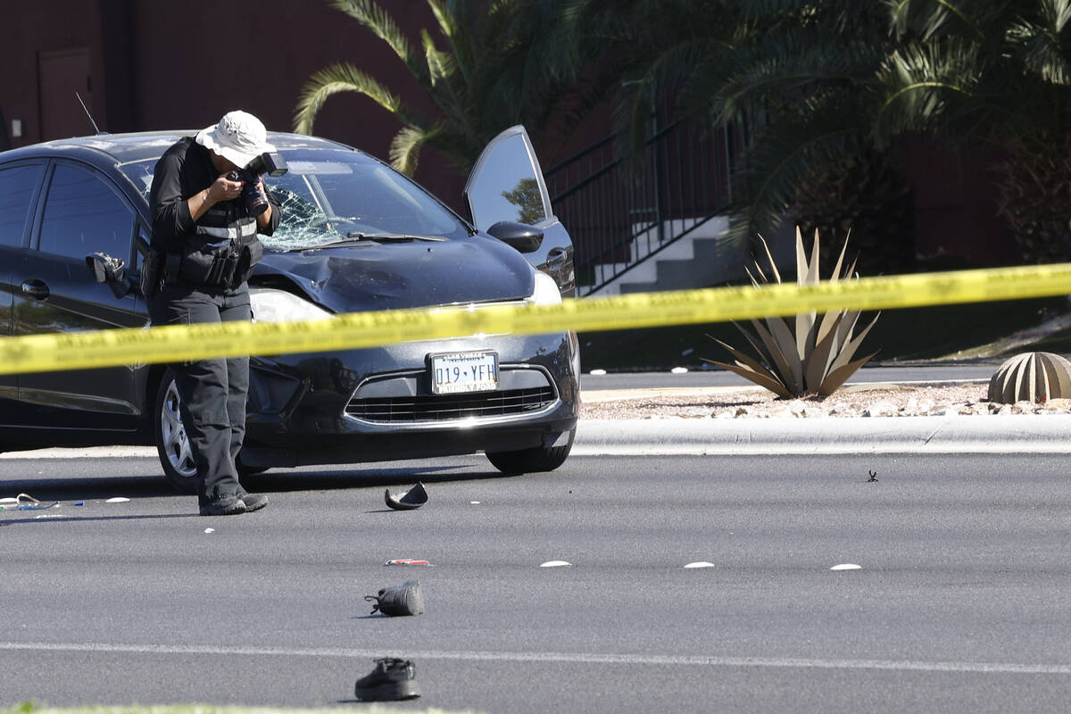 Police investigate a fatal crash on East Flamingo Road near Burnham Avenue, Tuesday, Sept. 27, ...