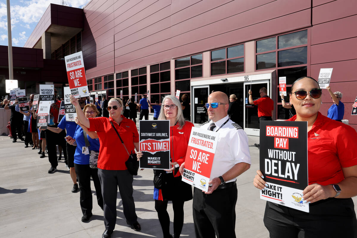 Southwest Airlines flight attendants picket outside Terminal 1 at Harry Reid International Airp ...