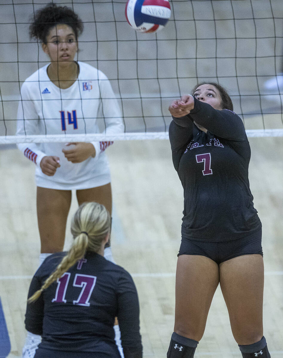 Faith Lutheran's Kayleigh Kennedy (7) digs the ball out as Bishop Gorman's Ayanna Wastson (14) ...