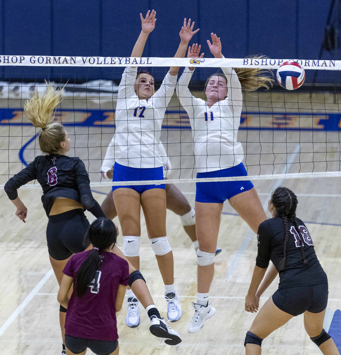 Bishop Gorman's Kendall Allgower (12) and Katelyn Eberwein (11) have a shot get passed by Faith ...