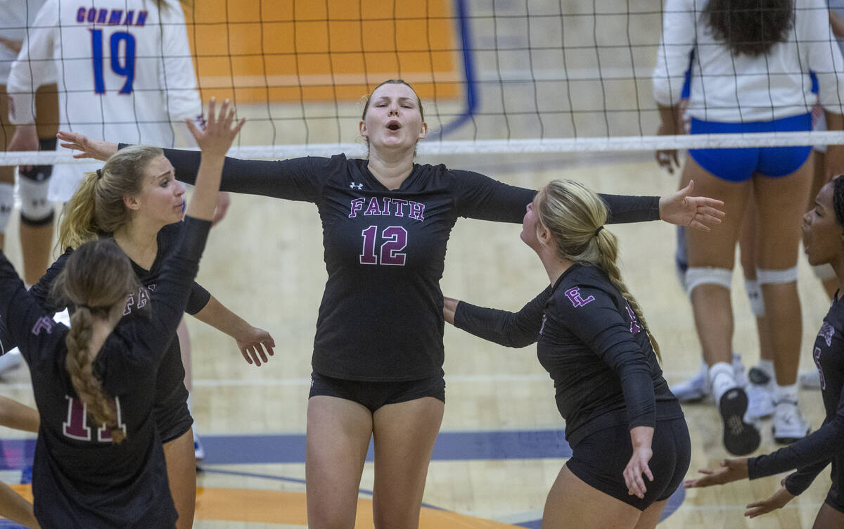 Faith Lutheran's Delaney Wilson (12) celebrates a win over Bishop Gorman during the second set ...
