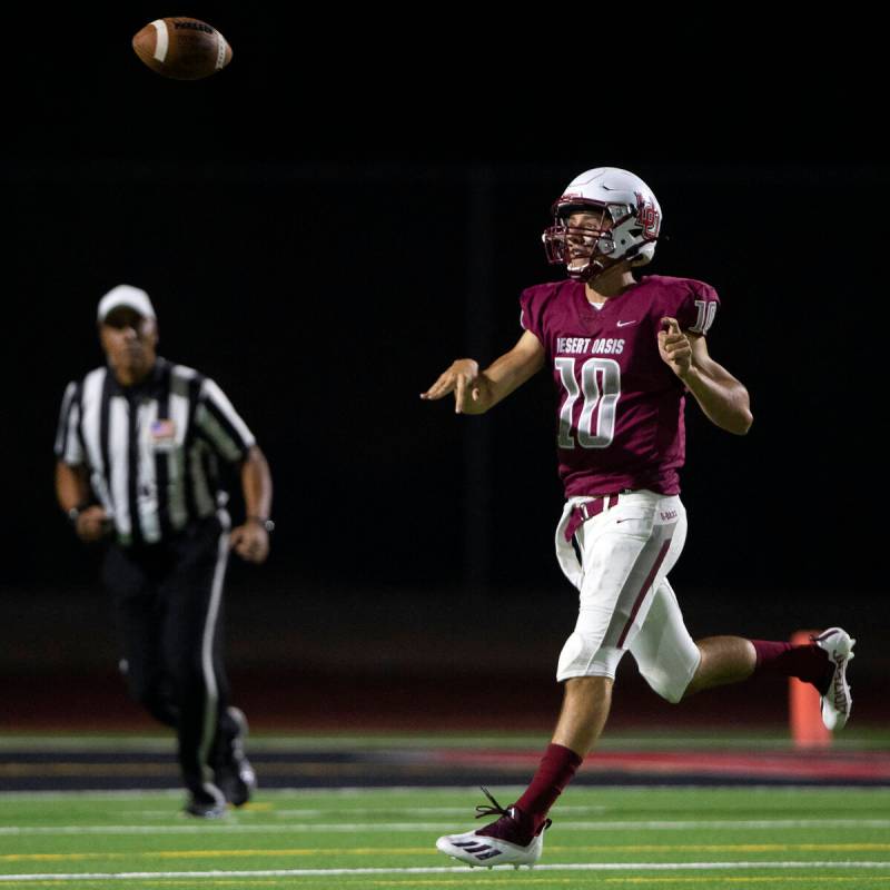 Desert Oasis quarterback Tyler Stott (10) passes during a high school football game against Spr ...