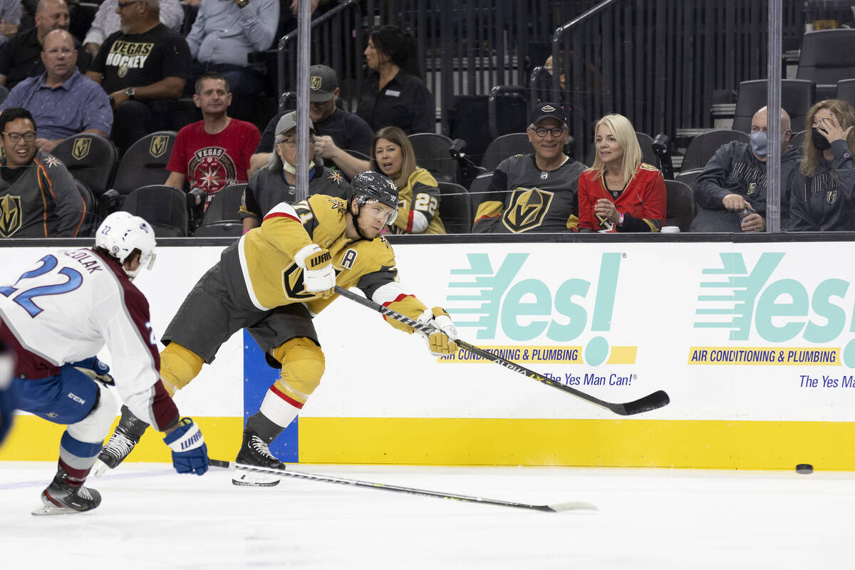 Golden Knights center William Karlsson (71) passes while Avalanche center Lukas Sedlak (22) clo ...