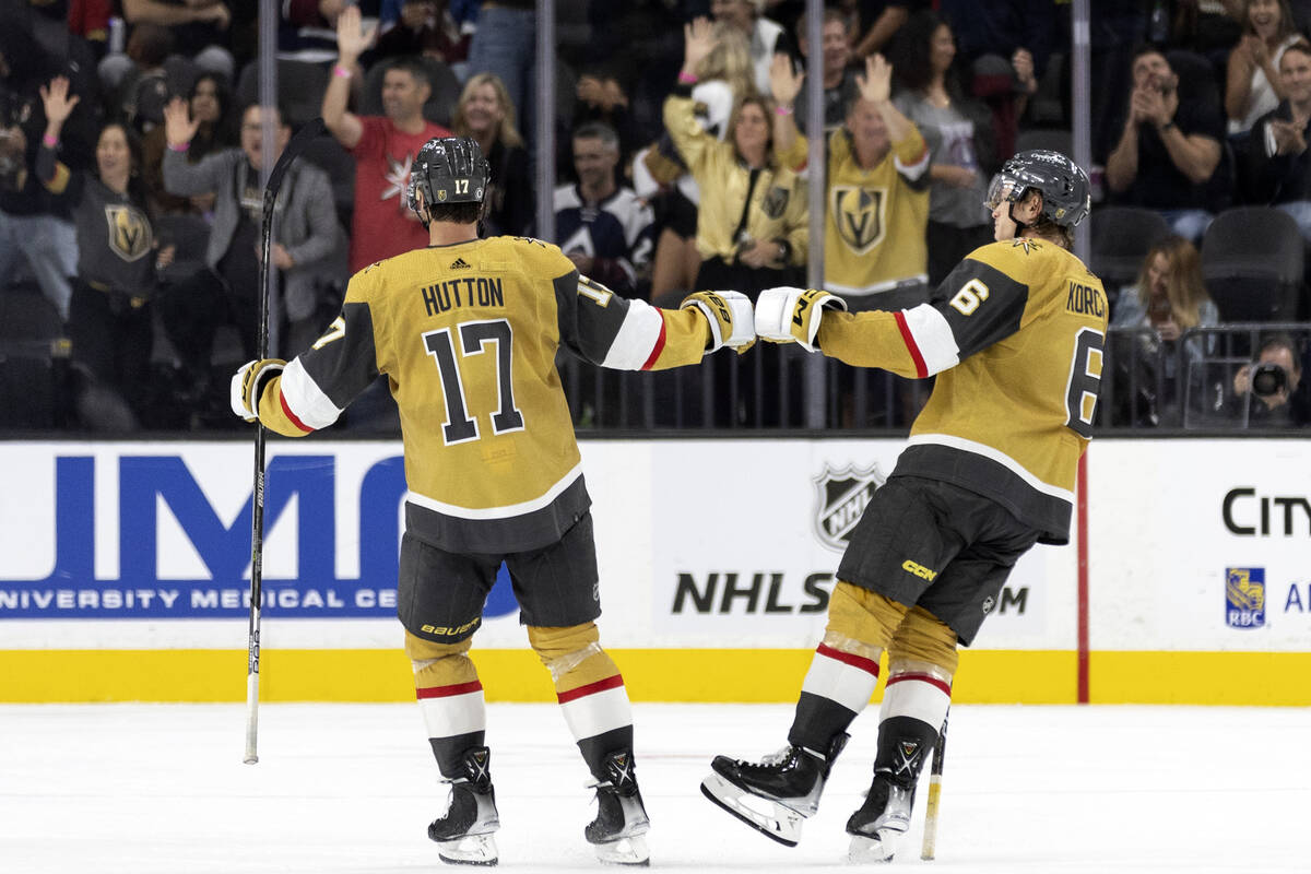 Golden Knights defenseman Ben Hutton (17) and Golden Knights defenseman Kaedan Korczak (6) cele ...