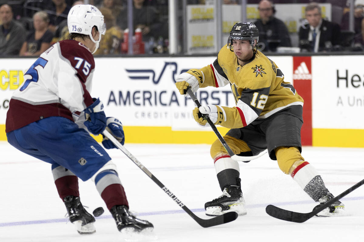 Golden Knights forward Jakub Brabenec (12) passes around Avalanche forward Sampo Ranta (75) dur ...