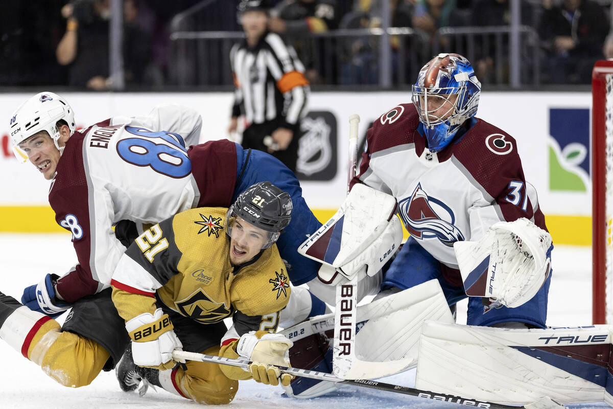 Avalanche defenseman Andreas Englund (88) and Golden Knights center Brett Howden (21) collide w ...