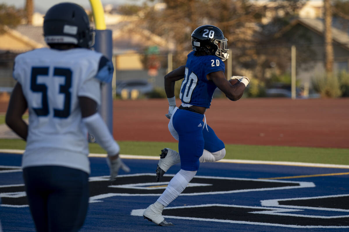 Desert Pines junior Isaiah Rubin (20) returns a punt for a touchdown during the first half of t ...