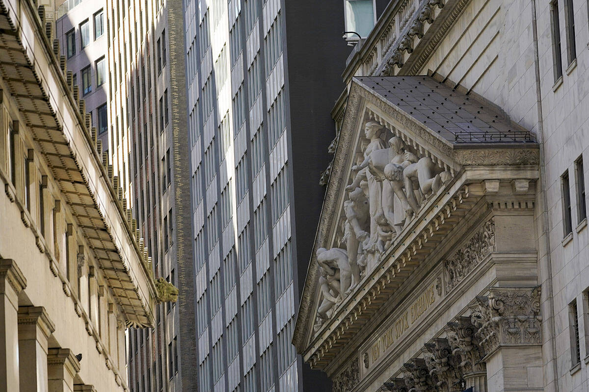 The New York Stock Exchange building, right, is seen, Tuesday, Sept. 27, 2022, in the Financial ...