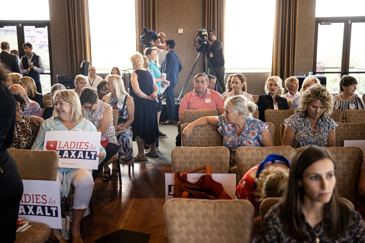 Supporters of Nevada Republican U.S. Senate candidate Adam Laxalt mingle during a campaign even ...