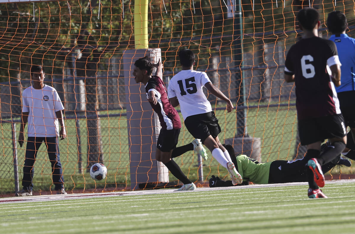 Cimarron-Memorial's midfielder Jonathon Walter (8) reacts after the team scored against Las Veg ...