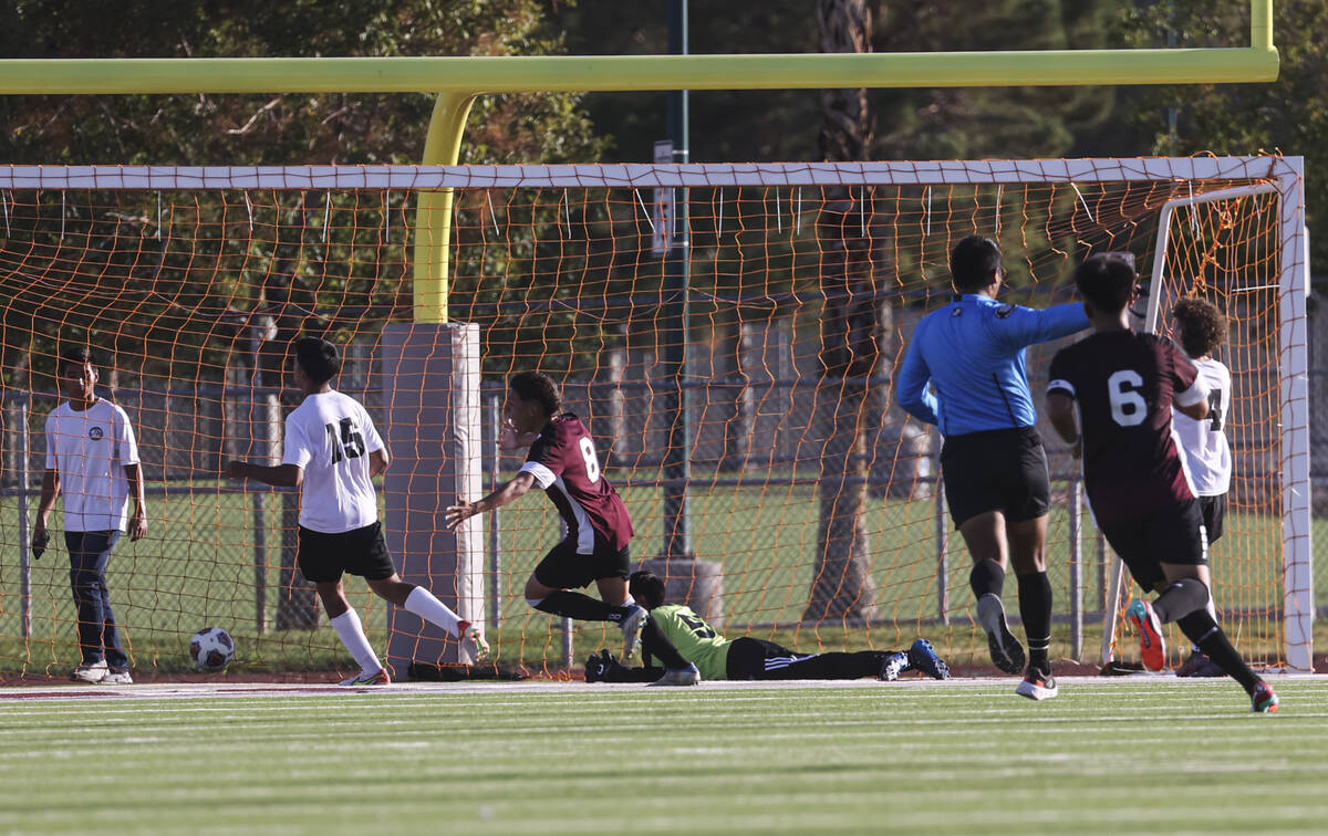Cimarron-Memorial's midfielder Jonathon Walter (8) reacts after the team scored against Las Veg ...
