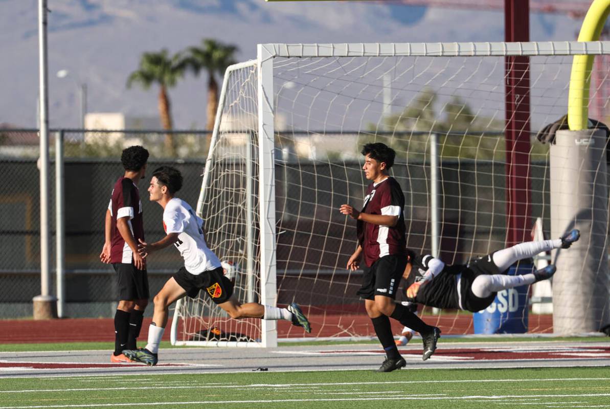 Las Vegas' Daniel Murillo (11) scores a goal past Cimarron-Memorial goalkeeper RJ Murillo (1) d ...