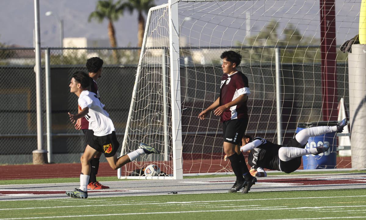 Las Vegas' Daniel Murillo (11) scores a goal past Cimarron-Memorial goalkeeper RJ Murillo (1) d ...