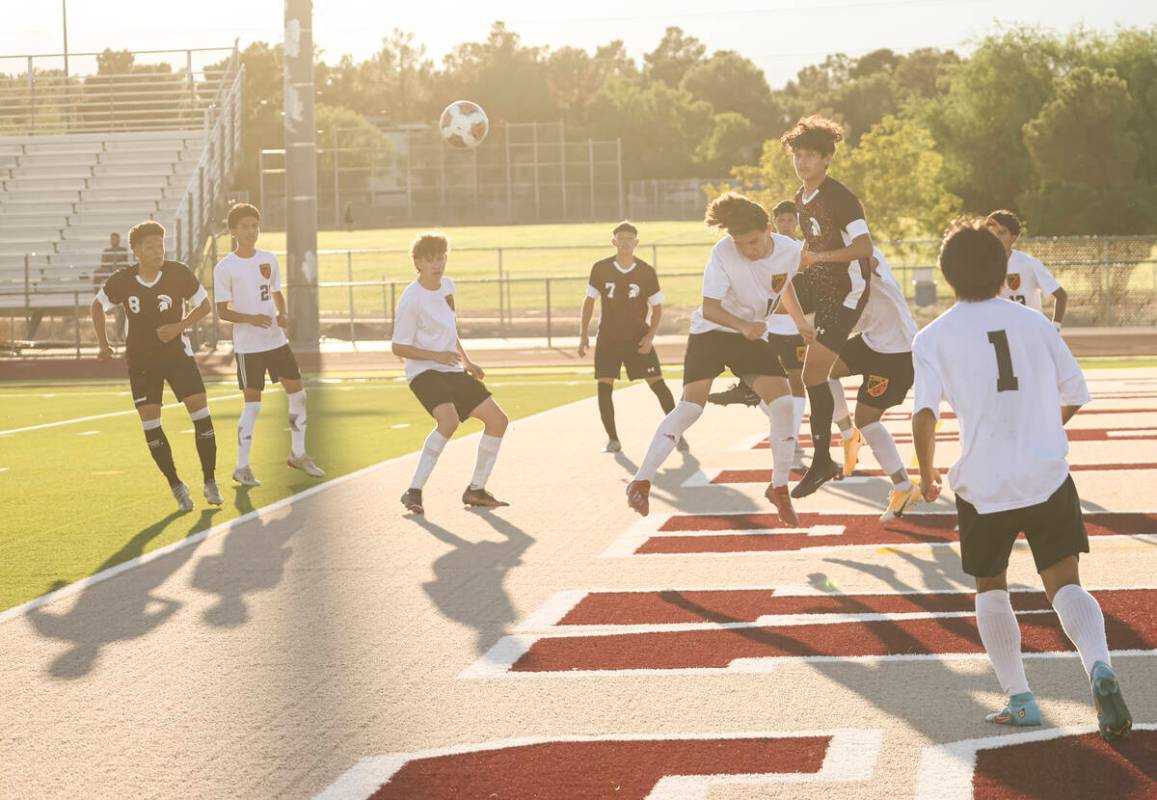 Las Vegas and Cimarron-Memorial players view for the ball during a soccer game at Cimarron-Memo ...
