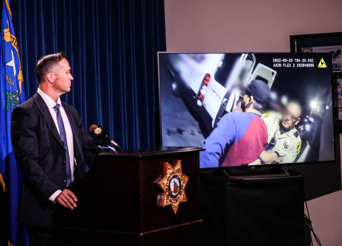 Metropolitan Police Department Capt. Branden Clarkson looks on as body camera footage shows the ...