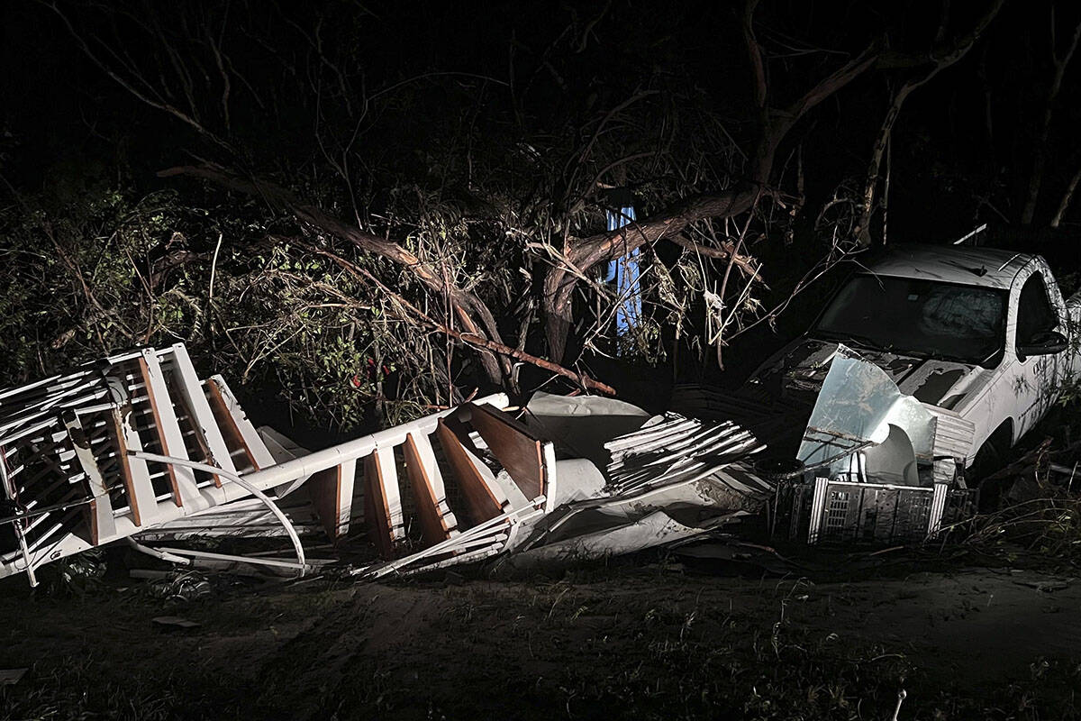 Just before the Sanibel Causeway, a spiral staircase was deposited in the brush next to a white ...