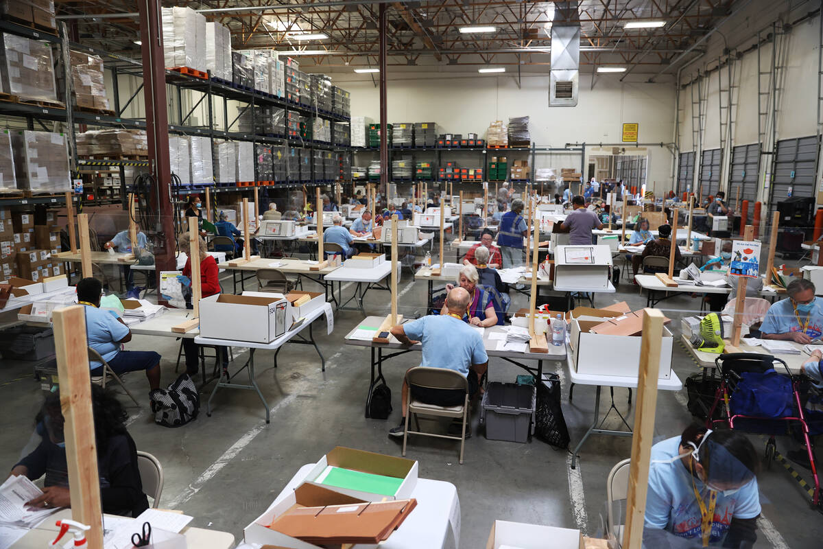 Workers count ballots at the Clark County Election Department in Henderson, Wednesday, June 10, ...