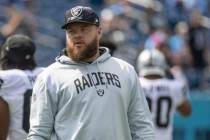 Raiders center Andre James watches team warm-ups before an NFL game against the Tennessee Titan ...