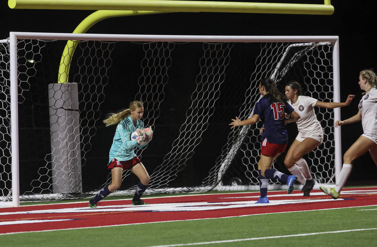 Liberty's Brooke Kramer (00) makes a save against Desert Oasis during a soccer game at Liberty ...