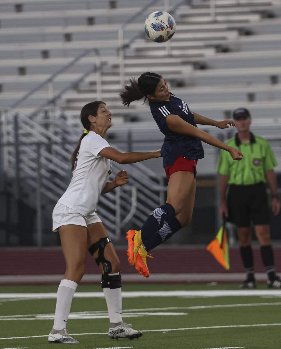 Liberty's Natalie Collins (2) heads the ball in front of Desert Oasis' Alyssa Turco (13) during ...