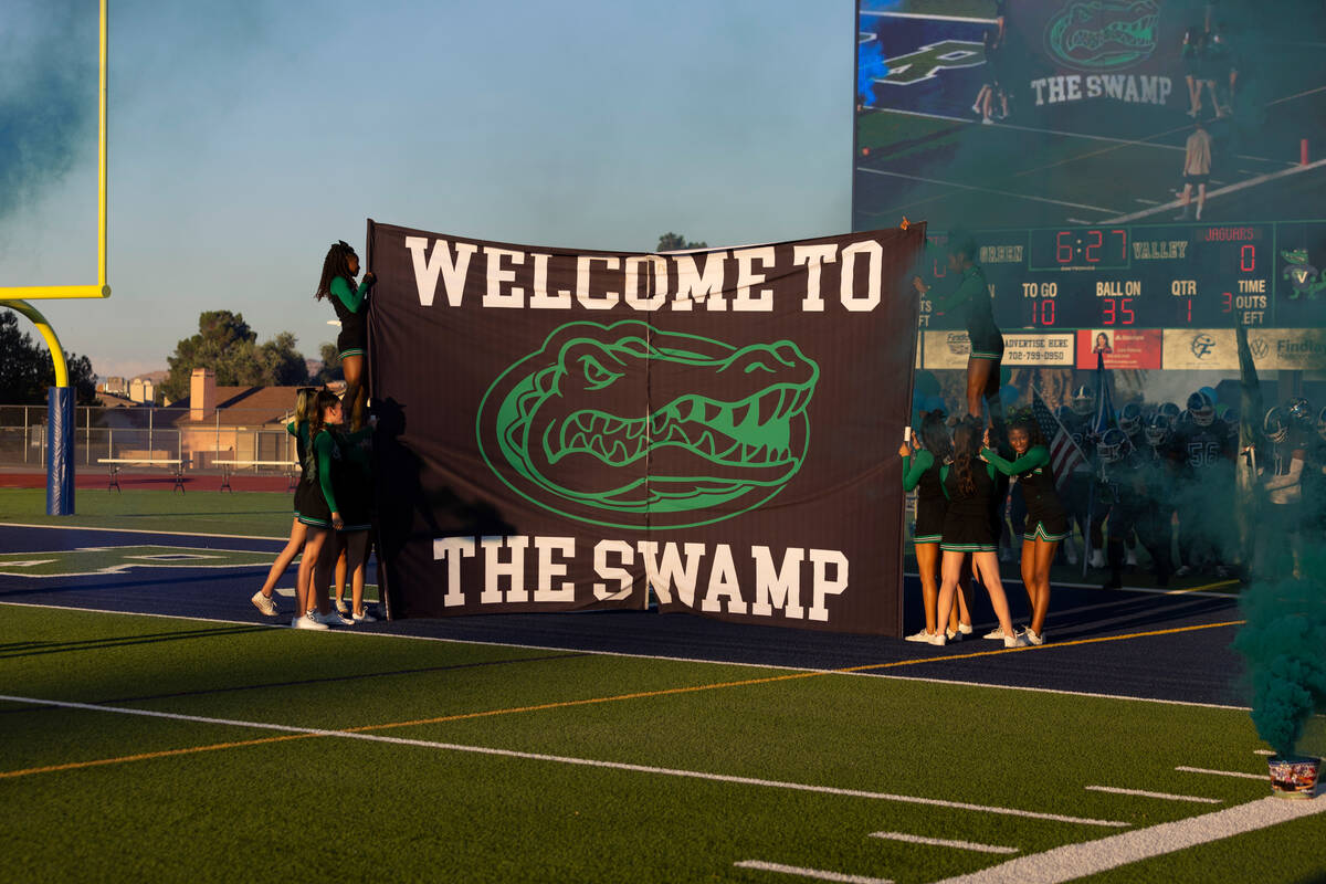 Green Valley players take the field for a football game against Desert Pines at Green Valley Hi ...