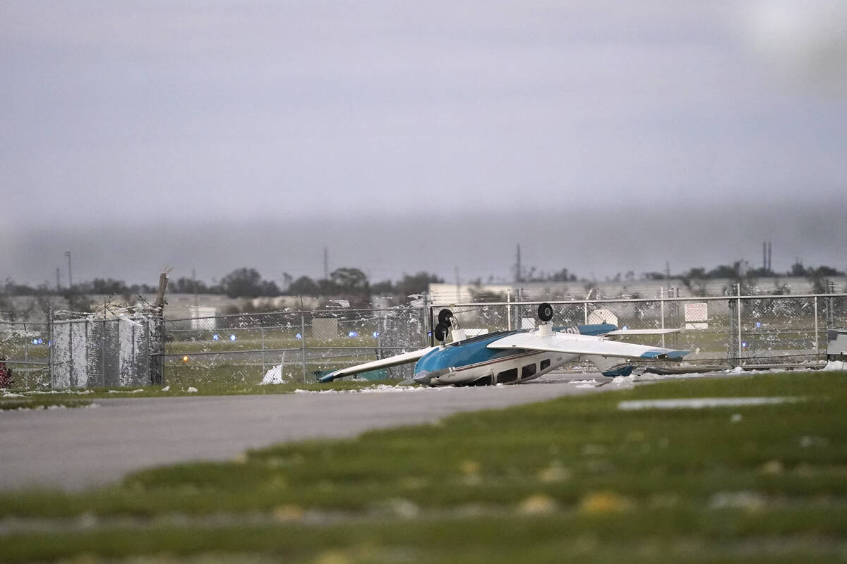 A damaged airplane is seen at the Punta Gorda Airport in the aftermath of Hurricane Ian, in Pun ...