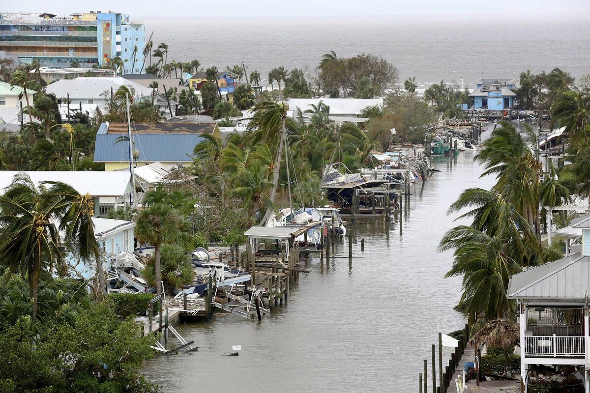 Homes, boats and docks lay in ruin in Fort Myers Beach, Fla., on Thursday, Sep 29, 2022, follow ...