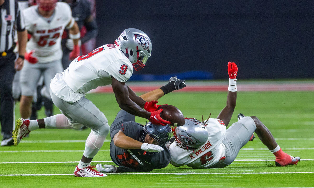 New Mexico Lobos safety Jerrick Reed II (9) recovers a fumble by UNLV Rebels wide receiver Nick ...