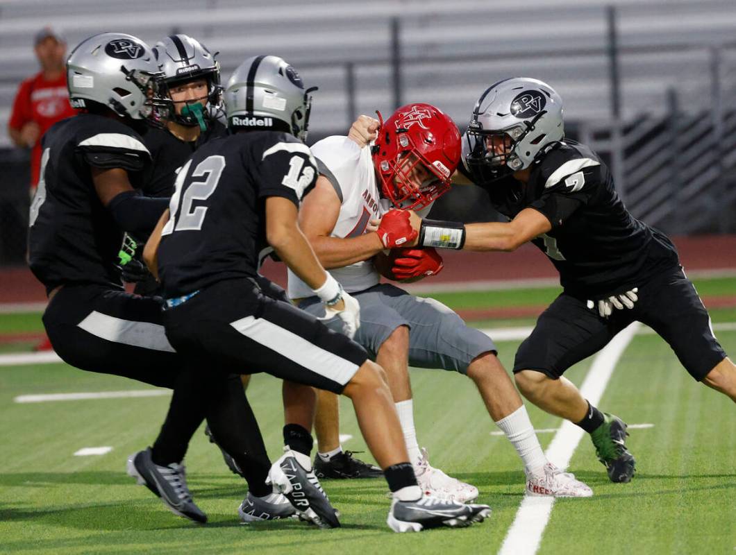 Palo Verde’s players including Colin Thielke (12) and Jace Neely (7) try to stop Arbor V ...