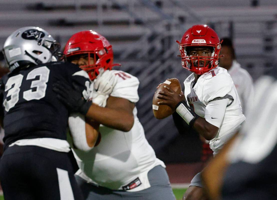 Arbor View’s quarterback Michael Kearns (7) looks to throw the ball during the first hal ...