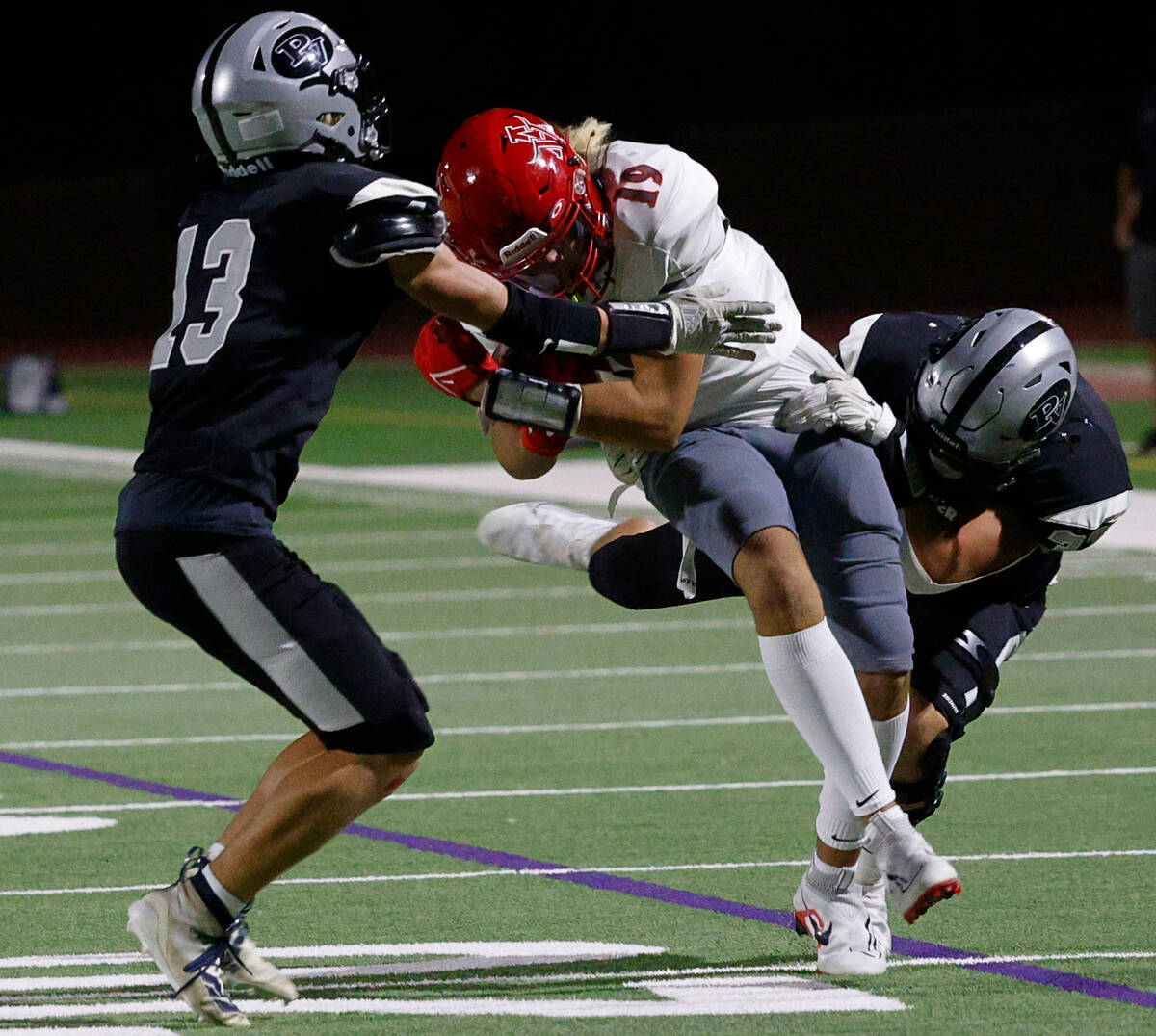 Arbor View’s Jackson Carpenter (19) is tackled by Palo Verde’s Tommy Gardner (13 ...