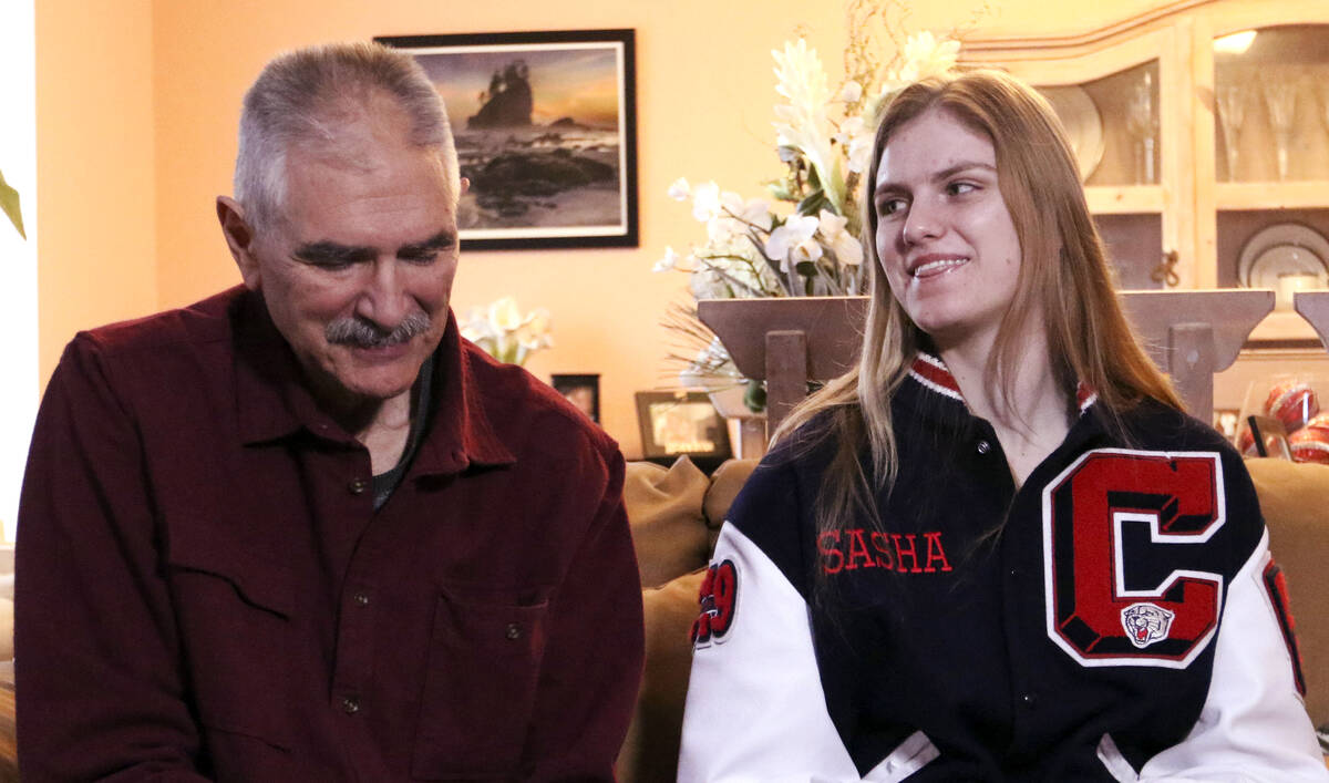 Sasha Bolla, daughter of former UNLV basketball coach Jim Bolla, left, smiles as she and her fa ...