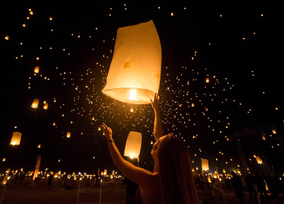 Delaney Evans releases her lantern during the RiSE Lantern Festival at Jean Dry Lake Bed on Fri ...