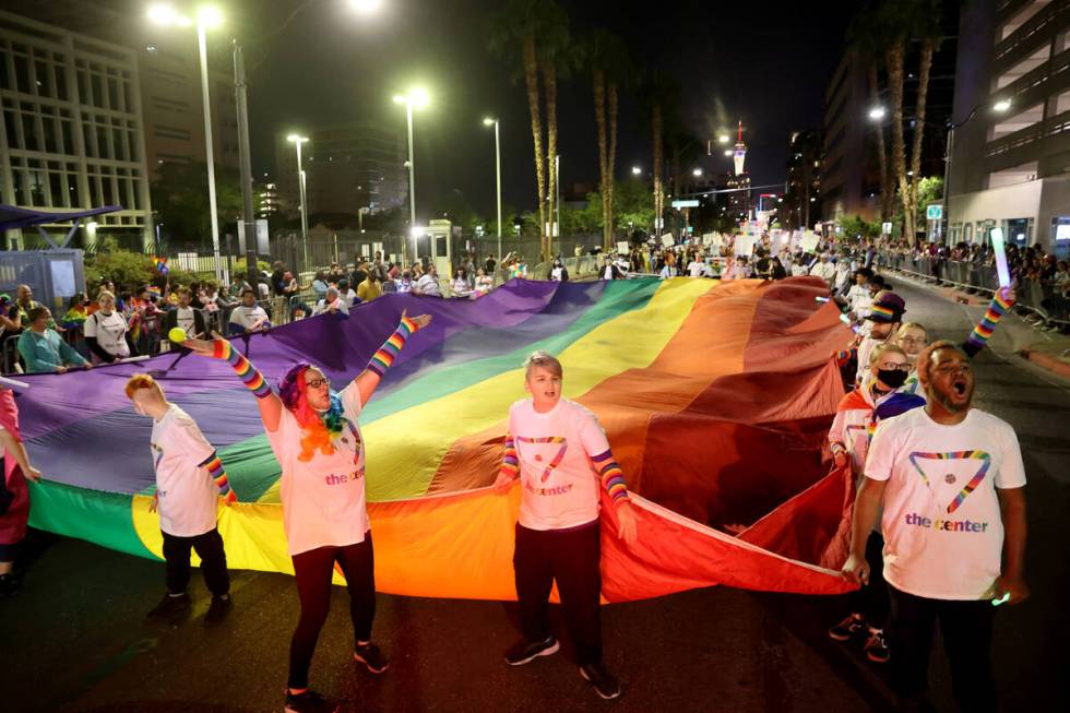 Members of The Center entry march in the Las Vegas Pride Night parade downtown Friday, Oct. 8, ...
