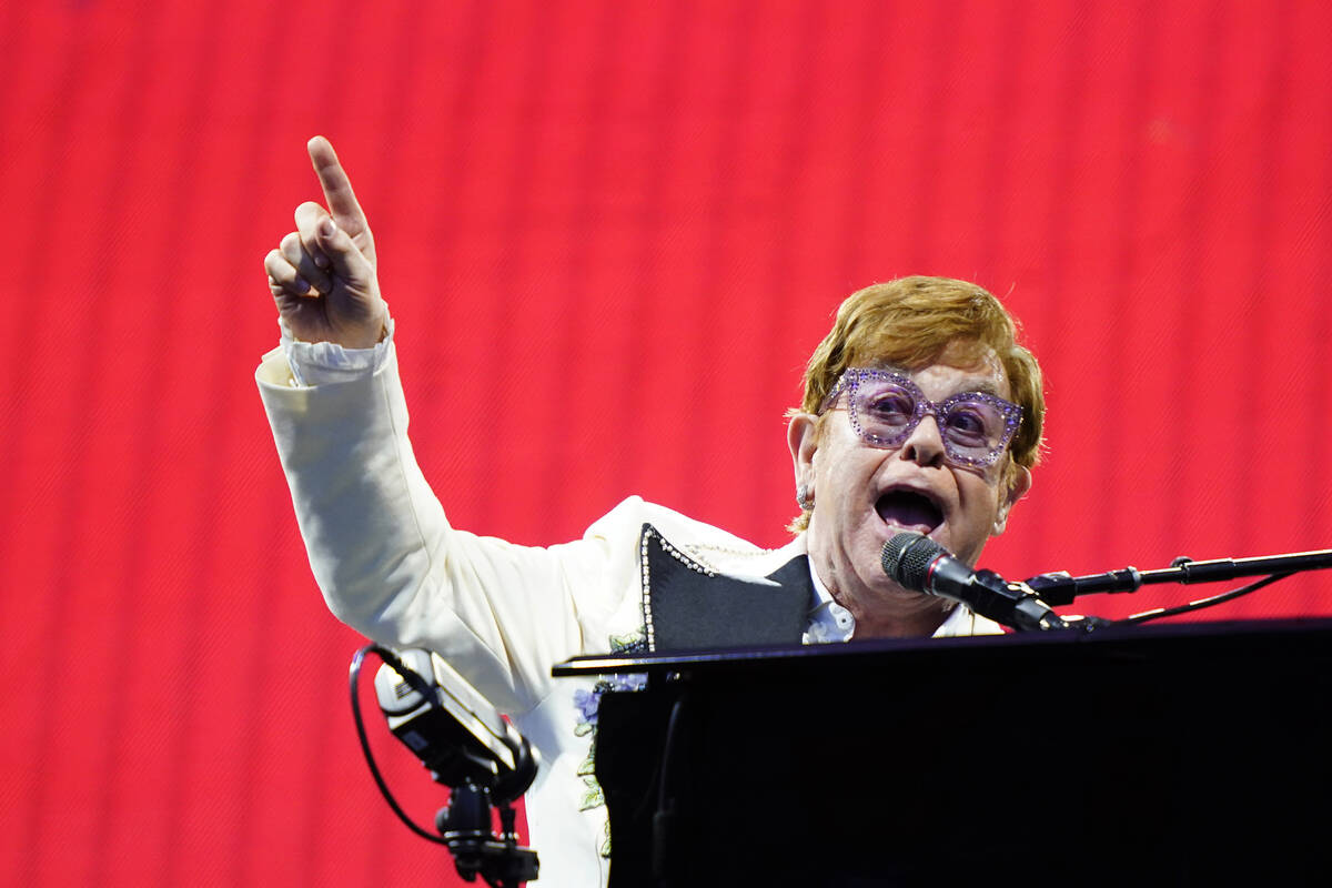FILE - Elton John performs during his "Farewell Yellow Brick Road," tour, Friday, Jul ...