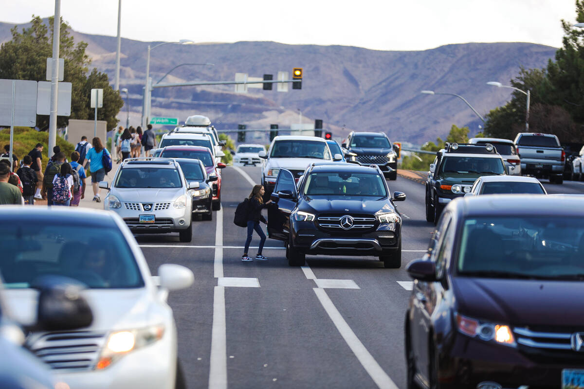 A student leaving Greenspun Junior High School in Henderson enters a car in the travel lane of ...