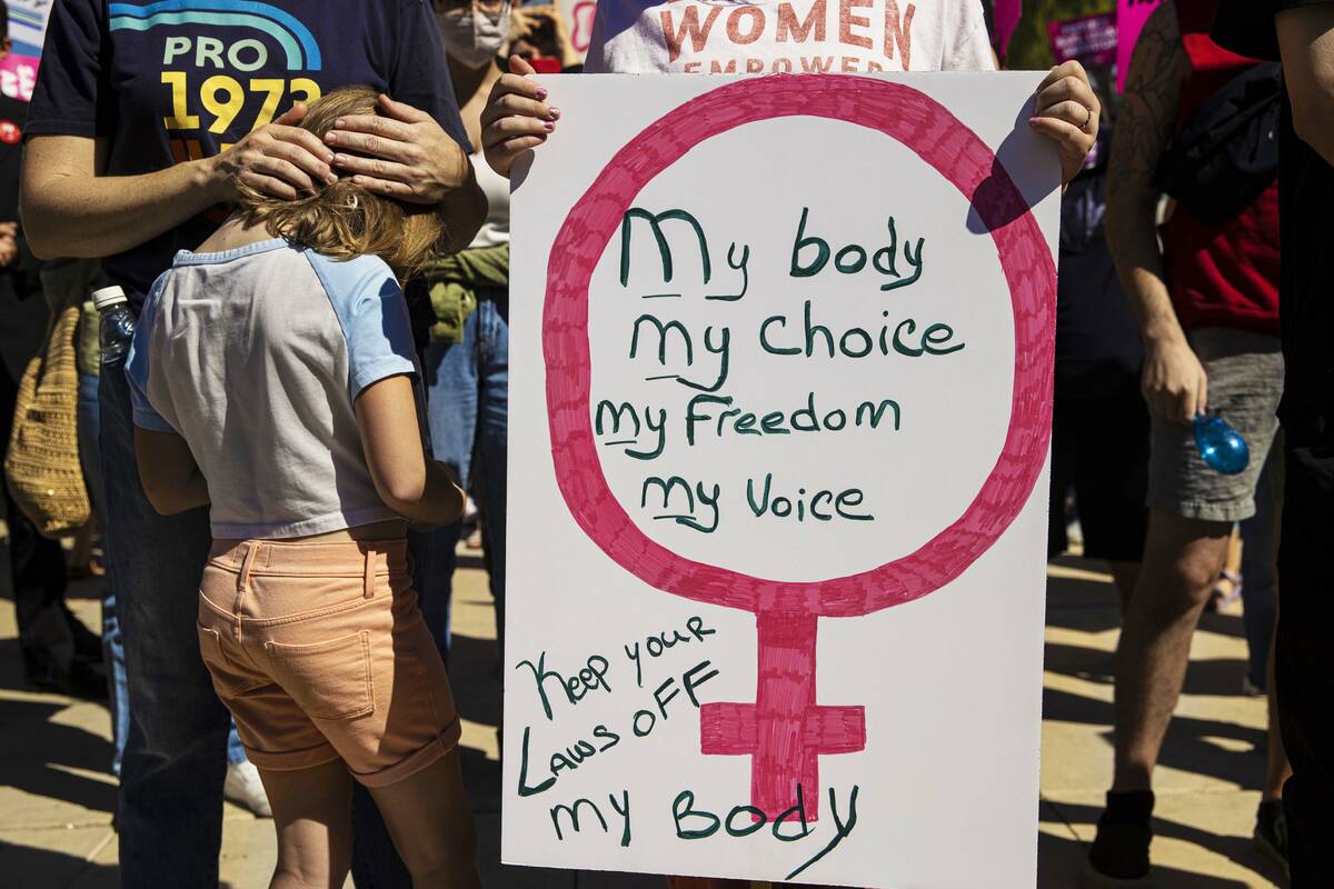 Demonstrators gather outside the Lloyd D George Courthouse during a March for Reproductive Righ ...