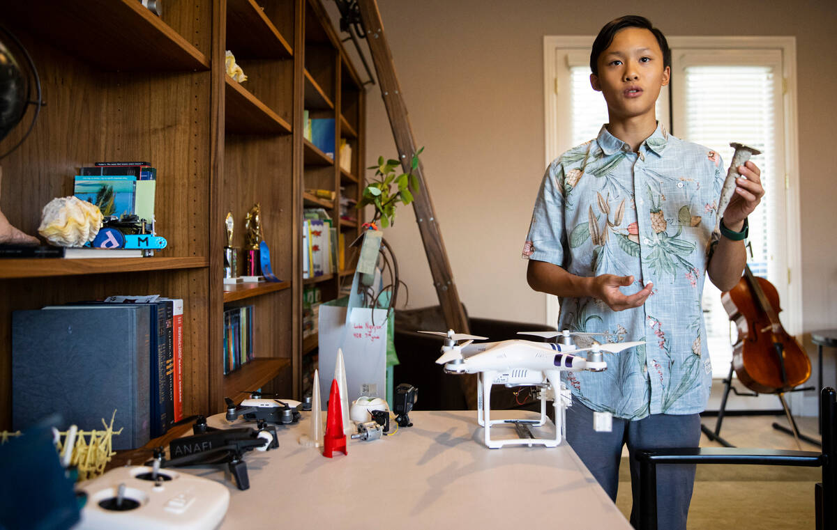Luka Nguyen, 13, talks about his mangrove tree carbon sequestration project at his home on Oct. ...
