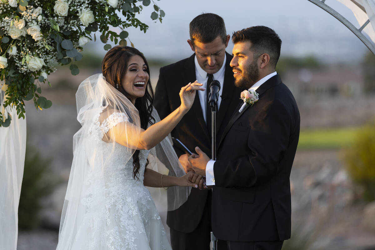 Brittany Castrejon, left, marries her fiancé, Jorge Gonzalez-Calvillo, during their weddin ...