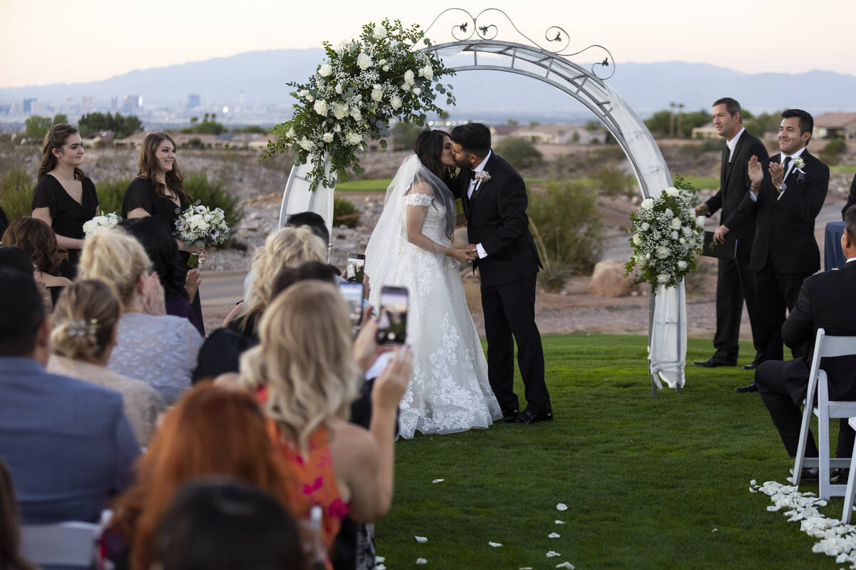 Brittany Castrejon, left, and her husband Jorge Gonzalez-Calvillo, share their first kiss a mar ...