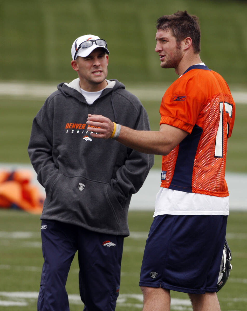 FILE-This April 30, 2010 file photo shows Denver Broncos head coach Josh McDaniels, left, chatt ...
