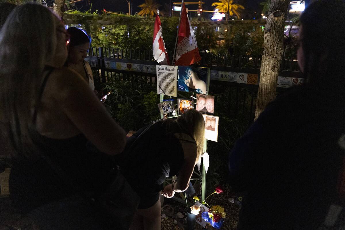 People attend a October 1 Remembrance Ceremony at the Las Vegas Community Healing Garden in Las ...