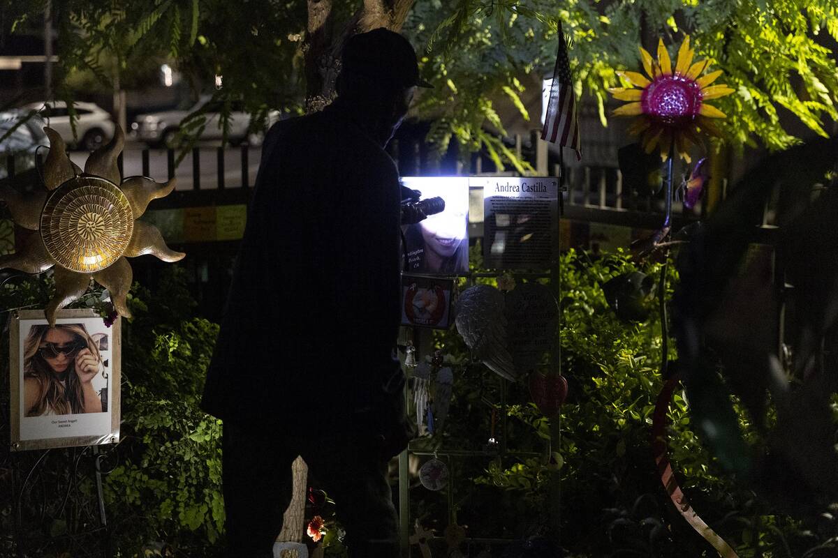 People attend a October 1 Remembrance Ceremony at the Las Vegas Community Healing Garden in Las ...