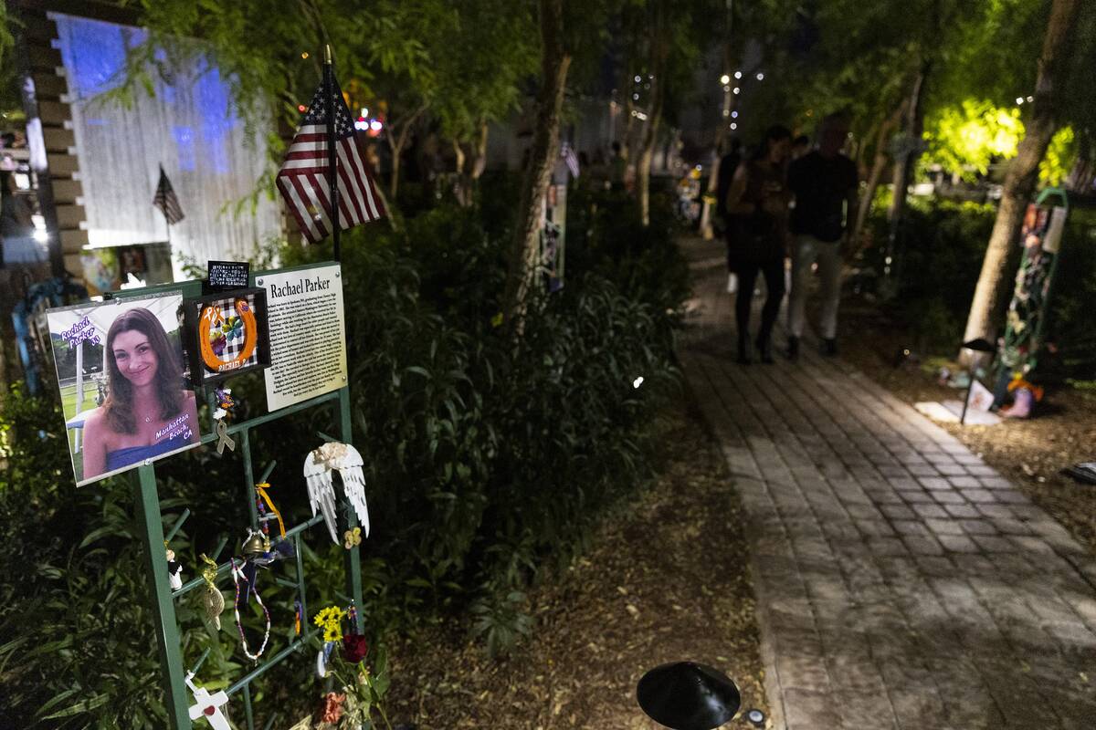 People attend a October 1 Remembrance Ceremony at the Las Vegas Community Healing Garden in Las ...