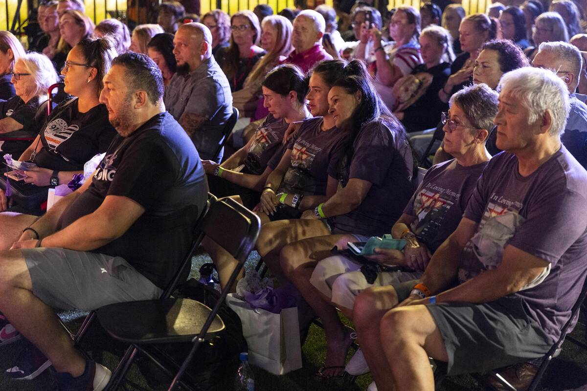 People attend the October 1 Remembrance Ceremony at the Las Vegas Community Healing Garden in L ...