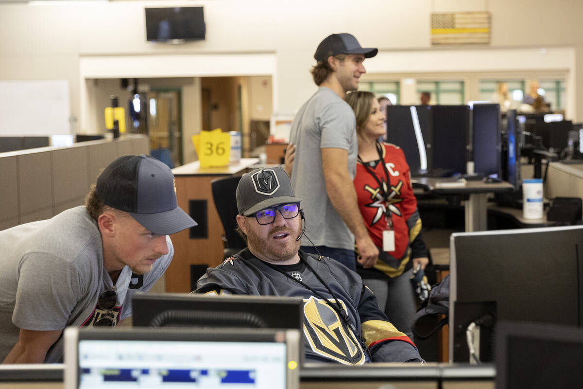 Golden Knights center Jack Eichel asks 911 call taker Colin Frabbiele questions about his job a ...