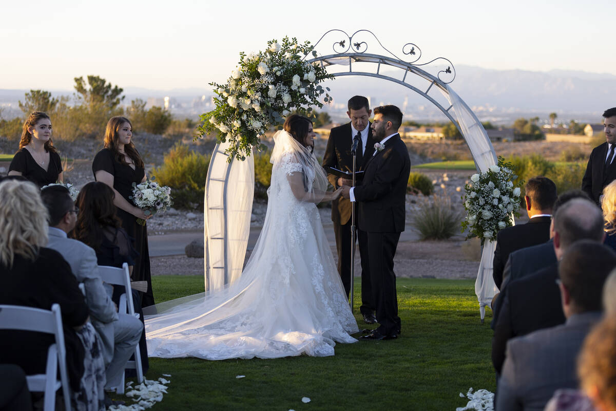 Brittany Castrejon, left, marries her fiancé, Jorge Gonzalez-Calvillo, during their weddin ...