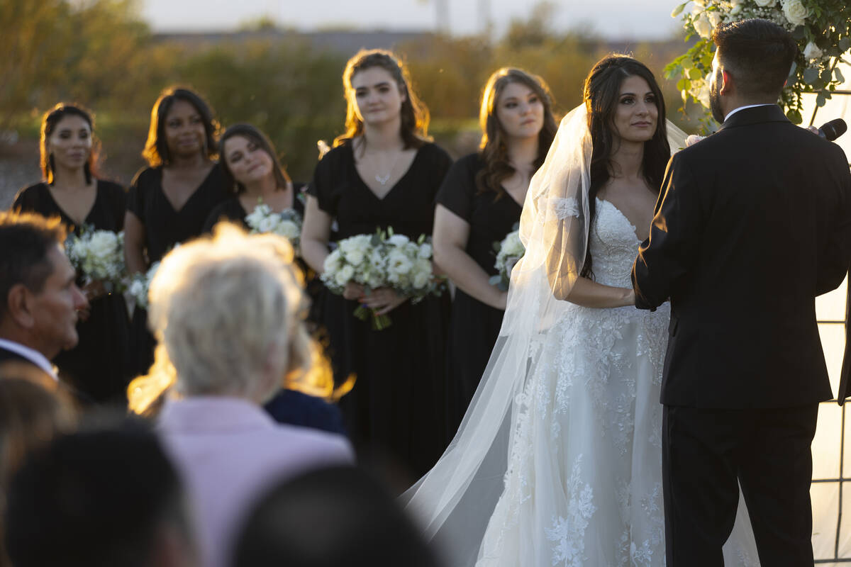 Brittany Castrejon, left, marries her fiancé, Jorge Gonzalez-Calvillo, during their weddin ...
