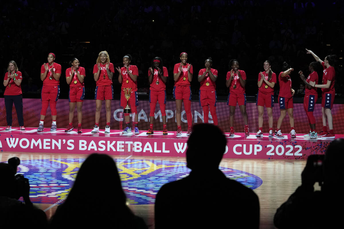 Players from the United States celebrate with with their medals after defeating China in their ...