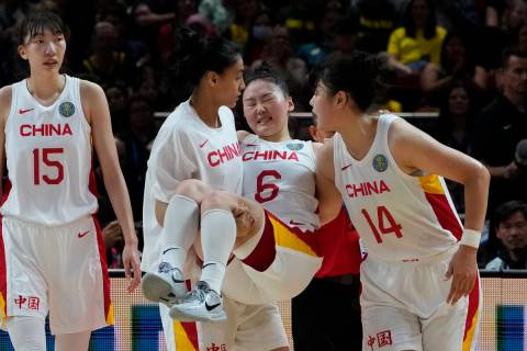 China's Wu Tongtong is carried from the court by teammates during their gold medal game at the ...